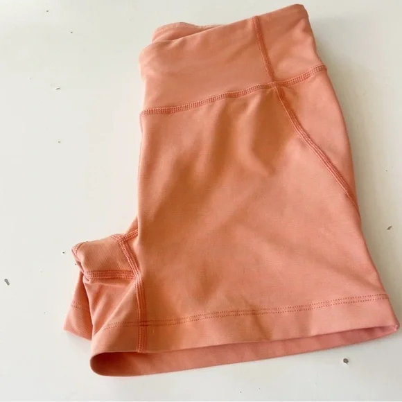 Outdoor Voices Tech Sweat Biker Shorts in Heathered Orange Peach - Picture 8 of 16